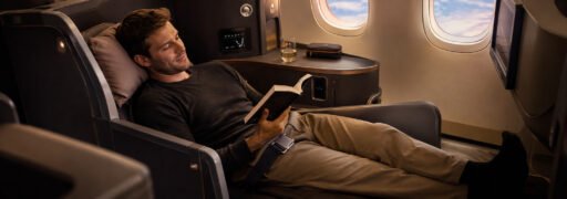 Traveler in business class lie-flat seat