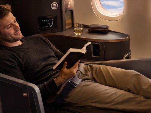 Traveler in business class lie-flat seat